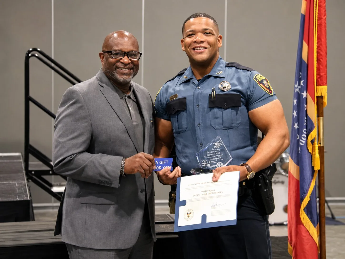 A police officer receiving recognition at an MSCPS event